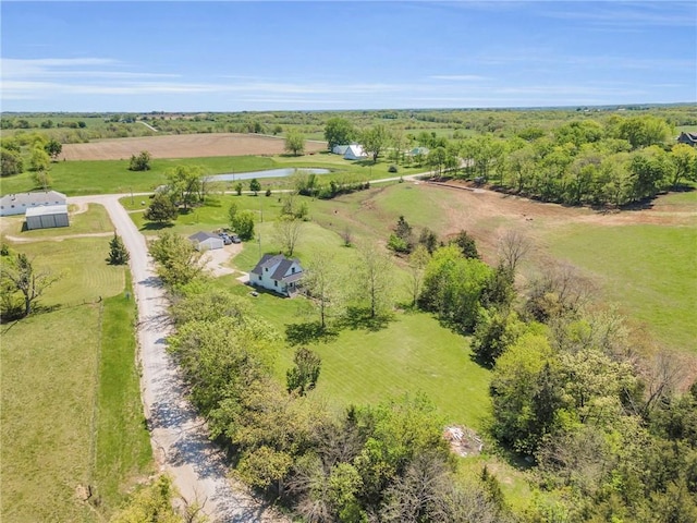 birds eye view of property featuring a rural view