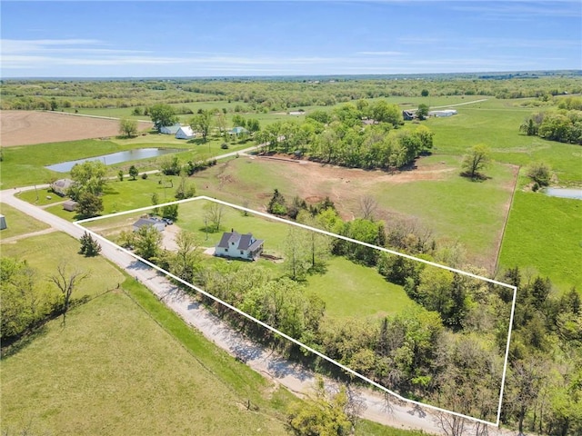 bird's eye view with a water view and a rural view