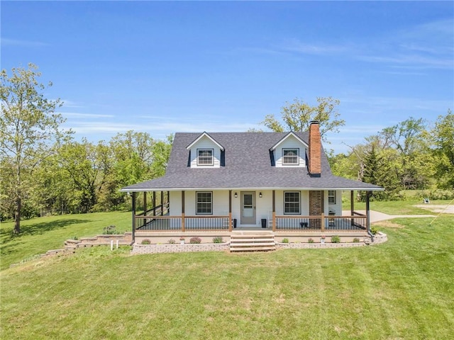 farmhouse with a chimney, a front lawn, roof with shingles, and covered porch