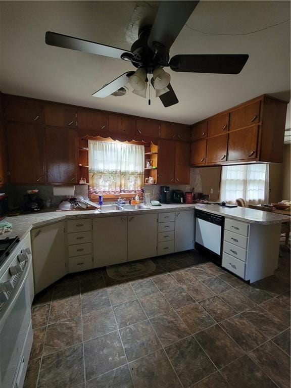 kitchen featuring open shelves, stainless steel range with gas cooktop, a ceiling fan, stone finish flooring, and dishwasher
