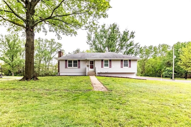 single story home with a front yard and a chimney