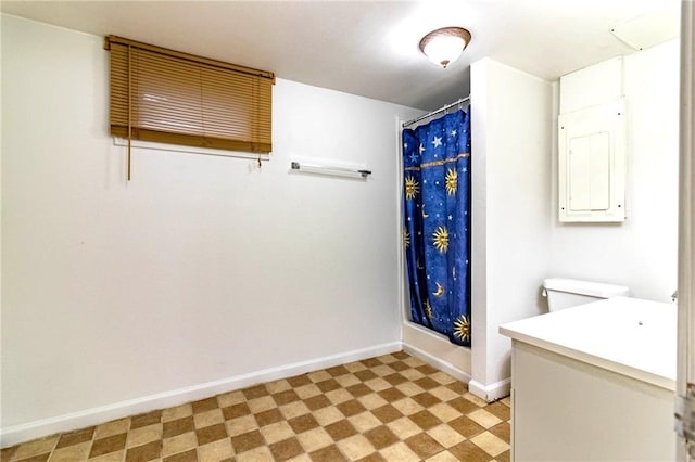 full bathroom featuring vanity, tile patterned floors, baseboards, a shower with curtain, and electric panel