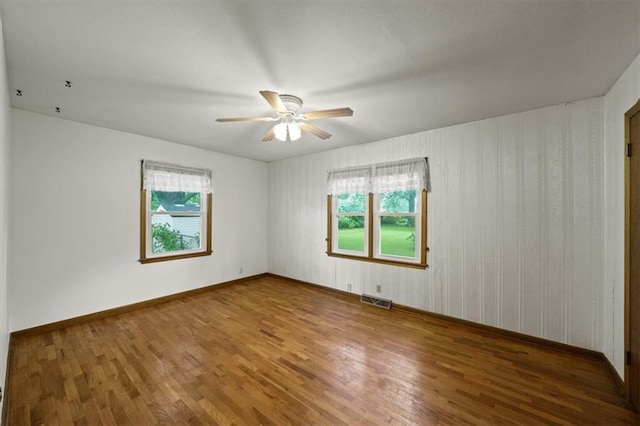 26335 W 321st Ter, Paola, KS 66071 - spare room featuring wood finished floors and a ceiling fan