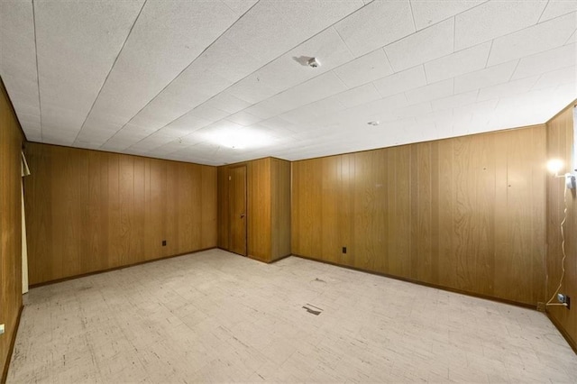 26335 W 321st Ter, Paola, KS 66071 - unfurnished room featuring wooden walls and light flooring