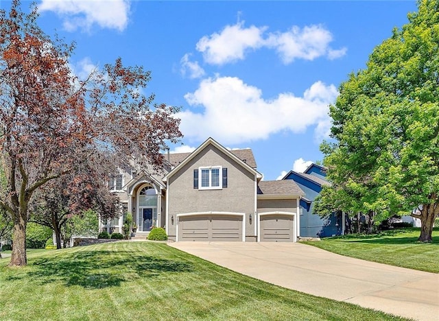 22420 W 44th Ter, Shawnee, KS 66226 - view of front of property featuring concrete driveway, a front lawn, stucco siding, and a garage