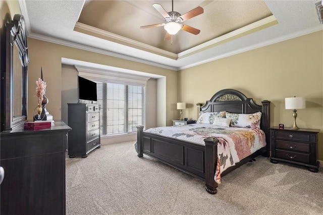 10522 N Garfield Ave, Kansas City, MO 64155 - bedroom with light colored carpet, a tray ceiling, ornamental molding, and ceiling fan