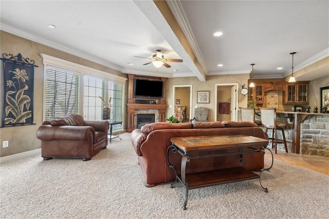 10522 N Garfield Ave, Kansas City, MO 64155 - living area featuring a glass covered fireplace, a ceiling fan, carpet floors, baseboards, and crown molding