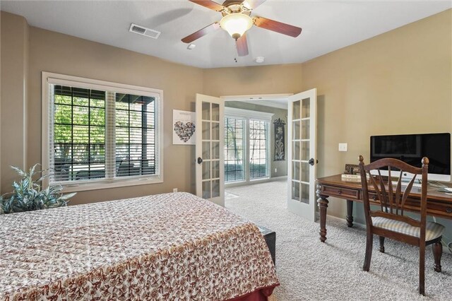 10522 N Garfield Ave, Kansas City, MO 64155 - carpeted bedroom with french doors, multiple windows, a ceiling fan, and baseboards