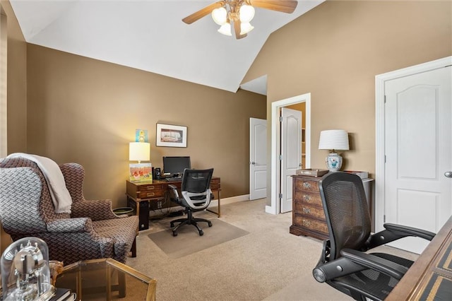 office space with a ceiling fan, carpet, high vaulted ceiling, and baseboards