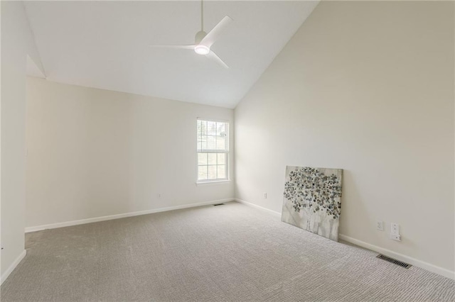 empty room with a ceiling fan, carpet floors, baseboards, and high vaulted ceiling