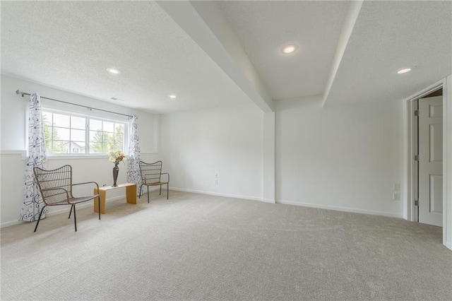 sitting room featuring carpet flooring, recessed lighting, a textured ceiling, and baseboards