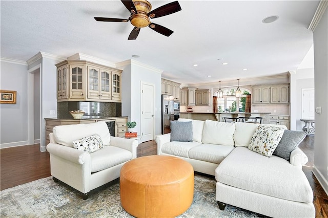 14575 Granada Cir, Leawood, KS 66224 - living room featuring ornamental molding, wood finished floors, a ceiling fan, recessed lighting, and beverage cooler