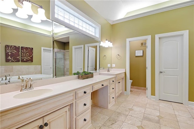 14575 Granada Cir, Leawood, KS 66224 - bathroom featuring double vanity, a shower stall, a garden tub, ornamental molding, and stone tile flooring