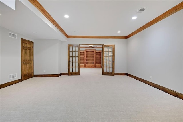 14575 Granada Cir, Leawood, KS 66224 - spare room featuring french doors, ornamental molding, carpet flooring, and recessed lighting