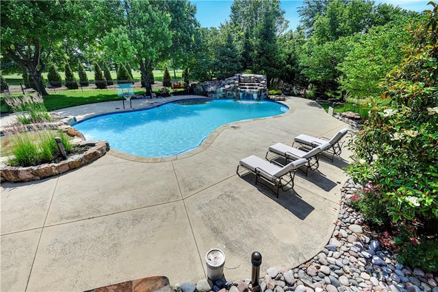 14575 Granada Cir, Leawood, KS 66224 - swimming pool featuring a patio area and view of scattered trees