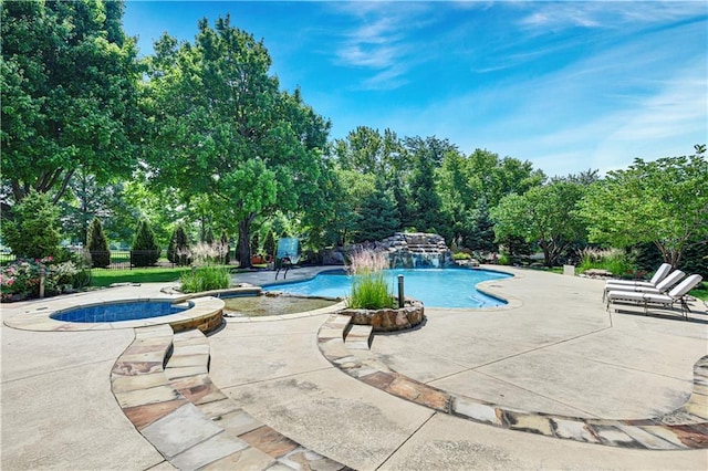 14575 Granada Cir, Leawood, KS 66224 - view of pool with a patio area, a pool with connected hot tub, and view of scattered trees