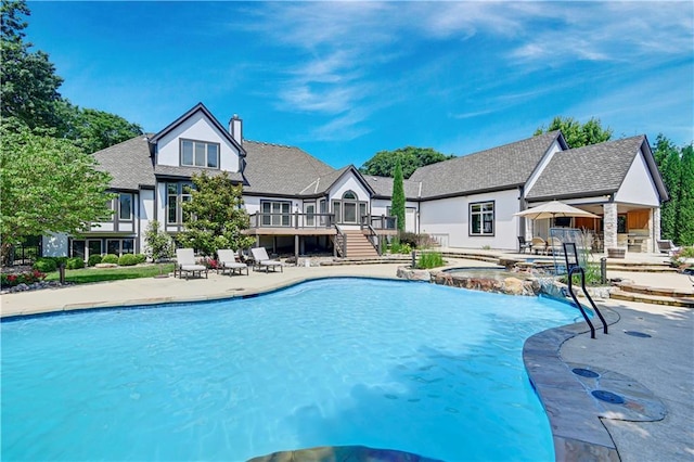 14575 Granada Cir, Leawood, KS 66224 - view of swimming pool featuring a wooden deck, a patio, a pool with connected hot tub, and stairway