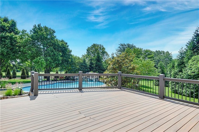 14575 Granada Cir, Leawood, KS 66224 - wooden deck with an outdoor pool and view of scattered trees