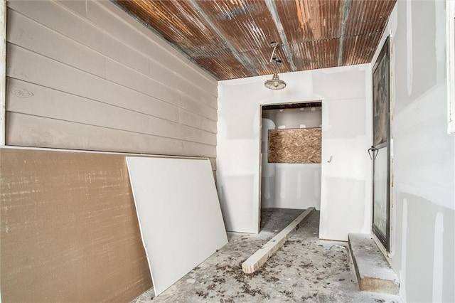 4904 Grandview Rd, Kansas City, MO 64137 - interior space featuring wooden walls and wooden ceiling