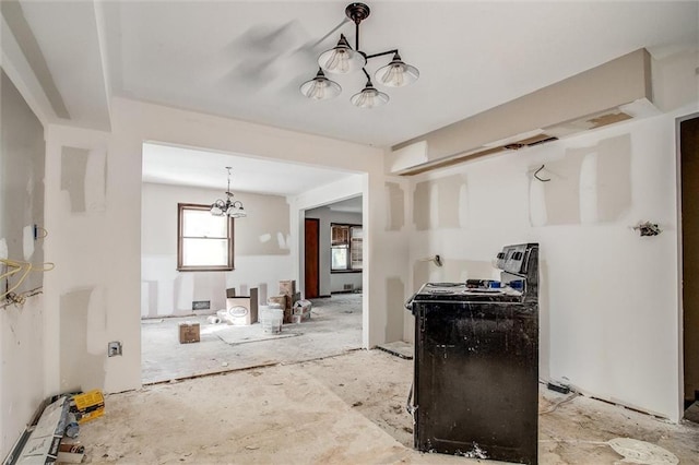 4904 Grandview Rd, Kansas City, MO 64137 - kitchen featuring decorative light fixtures, black range with electric cooktop, and a notable chandelier