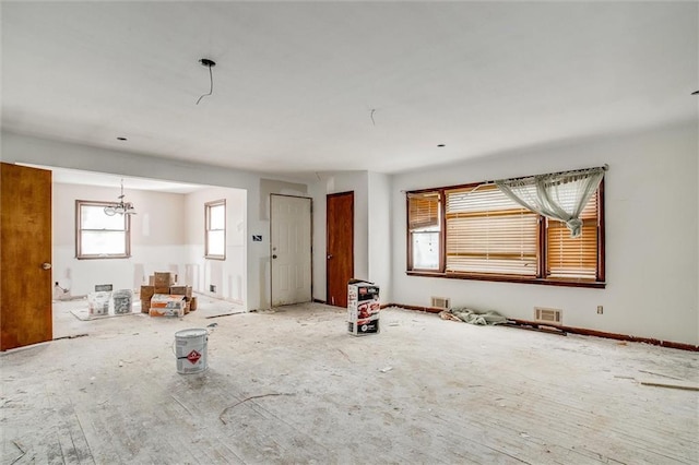 4904 Grandview Rd, Kansas City, MO 64137 - interior space featuring visible vents and a chandelier
