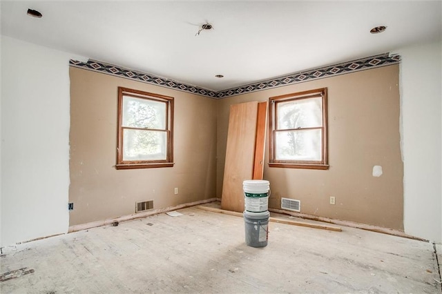 4904 Grandview Rd, Kansas City, MO 64137 - unfurnished room with plenty of natural light and visible vents