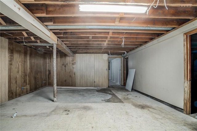 4904 Grandview Rd, Kansas City, MO 64137 - unfinished below grade area featuring wood walls