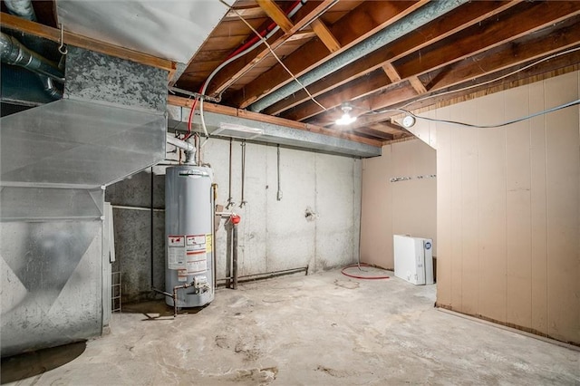 4904 Grandview Rd, Kansas City, MO 64137 - unfinished below grade area featuring water heater