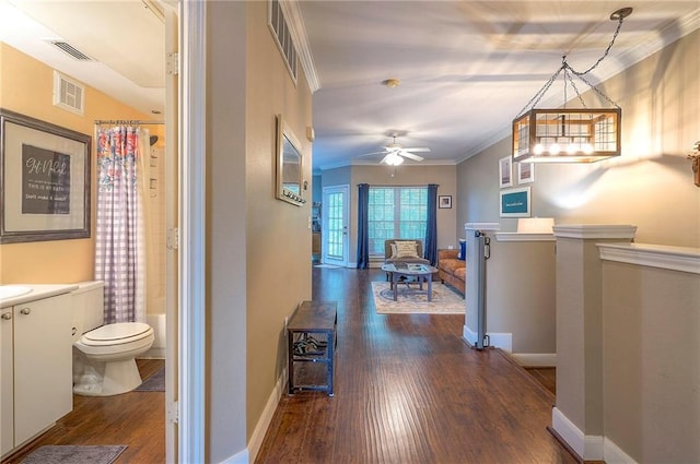 11629 Tomahawk Creek Pkwy Unit G, Leawood, KS 66211 - hall with dark wood-style floors, ornamental molding, and baseboards