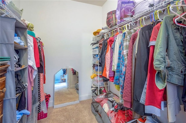 11629 Tomahawk Creek Pkwy Unit G, Leawood, KS 66211 - walk in closet featuring carpet