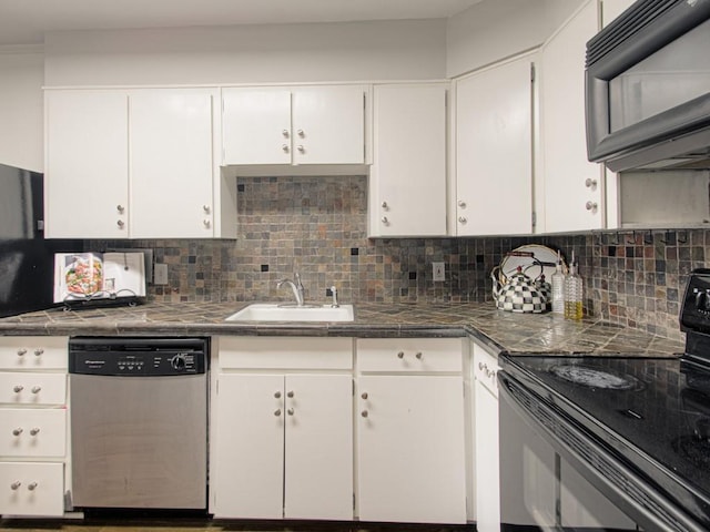 kitchen featuring black appliances, a sink, white cabinetry, and tasteful backsplash