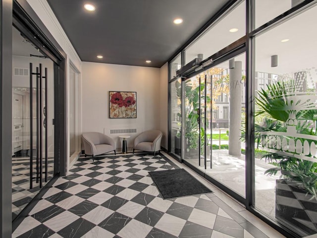 lobby with recessed lighting and a wall of windows