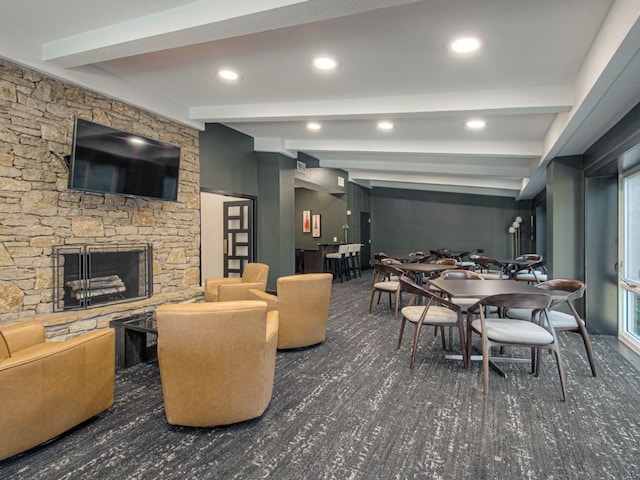 dining space featuring beam ceiling, a fireplace, and recessed lighting