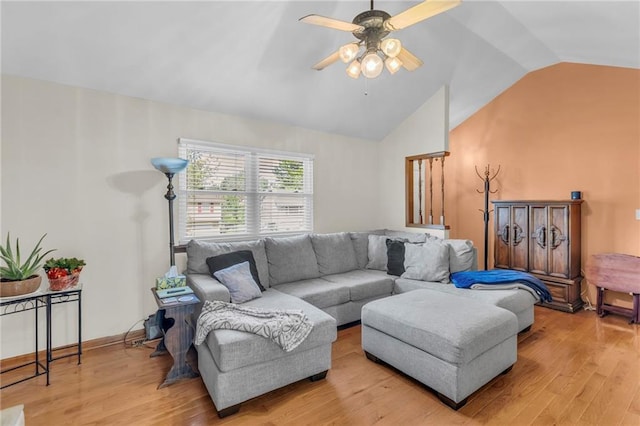 living room with lofted ceiling, a ceiling fan, and light wood finished floors
