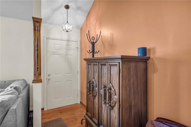 entrance foyer featuring light wood finished floors and baseboards