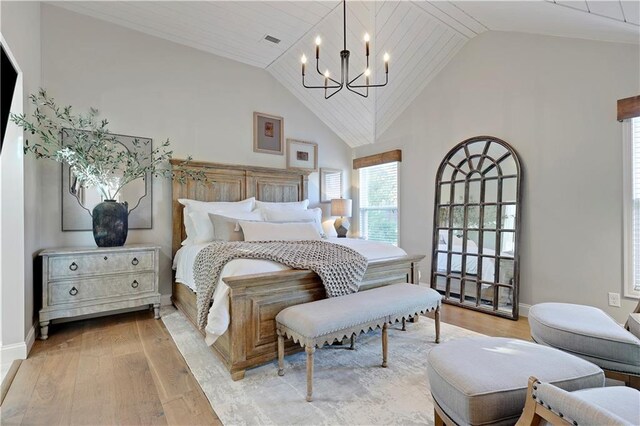 5918 Theden St, Shawnee, KS 66218 - bedroom with a chandelier, light wood-style floors, baseboards, and high vaulted ceiling