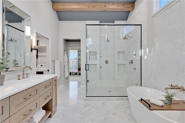 5918 Theden St, Shawnee, KS 66218 - bathroom featuring a stall shower, vanity, beam ceiling, a soaking tub, and washer / dryer