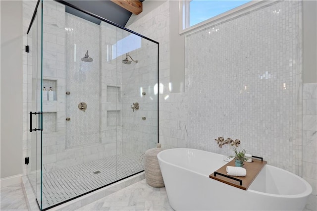 5918 Theden St, Shawnee, KS 66218 - bathroom featuring tile walls, a freestanding bath, a stall shower, and marble finish floors