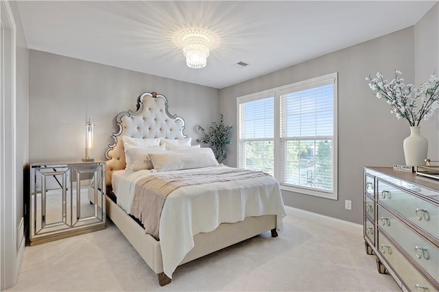 5918 Theden St, Shawnee, KS 66218 - bedroom with light carpet, baseboards, and a chandelier