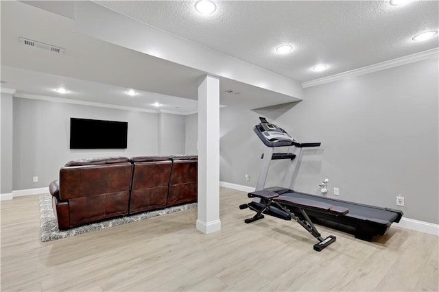 5918 Theden St, Shawnee, KS 66218 - exercise room with a textured ceiling, ornamental molding, wood finished floors, baseboards, and recessed lighting