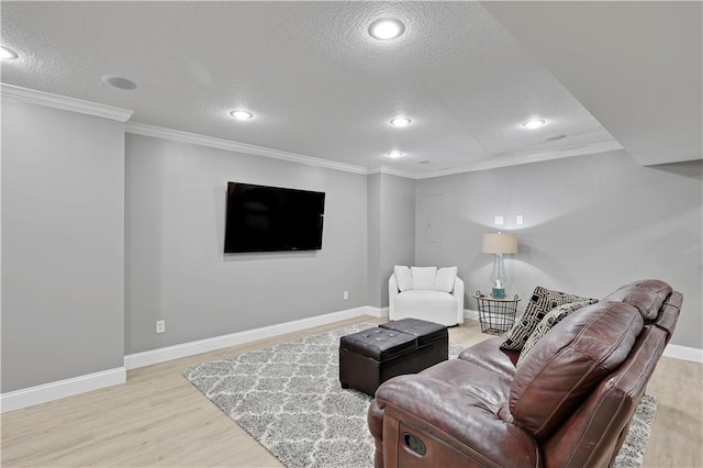 5918 Theden St, Shawnee, KS 66218 - living room featuring a textured ceiling, light wood-style floors, recessed lighting, baseboards, and ornamental molding