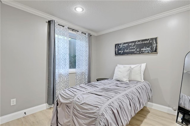 5918 Theden St, Shawnee, KS 66218 - bedroom featuring a textured ceiling, wood finished floors, crown molding, and baseboards