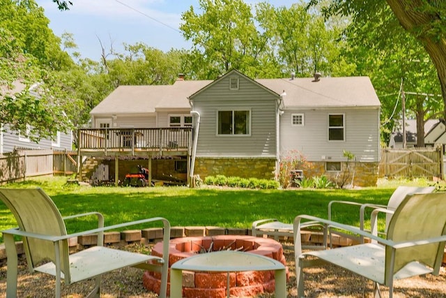 6138 Hadley St, Merriam, KS 66202 - back of property featuring an outdoor fire pit, a wooden deck, stairs, and a chimney