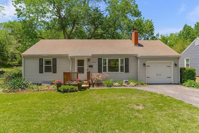 6138 Hadley St, Merriam, KS 66202 - ranch-style home with driveway, an attached garage, a chimney, and a front lawn