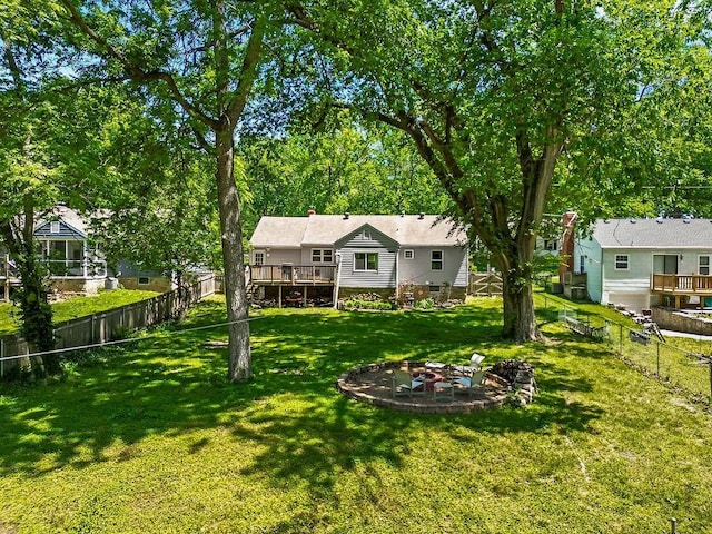 6138 Hadley St, Merriam, KS 66202 - view of yard featuring a fire pit and a deck
