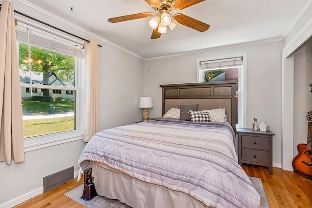 6138 Hadley St, Merriam, KS 66202 - bedroom with wood finished floors, baseboards, crown molding, and ceiling fan