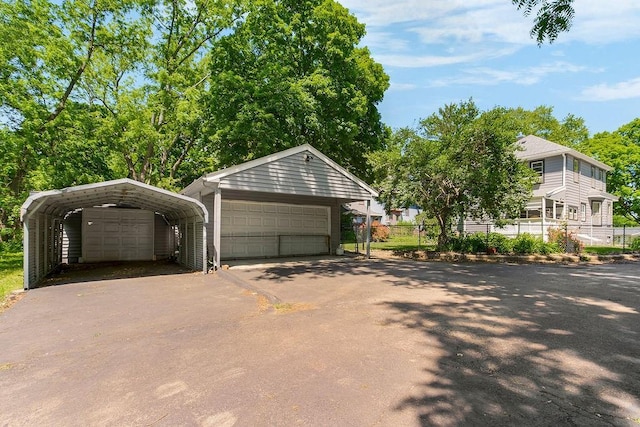 2312 Maple Ave, Leavenworth, KS 66048 - detached garage featuring a detached carport