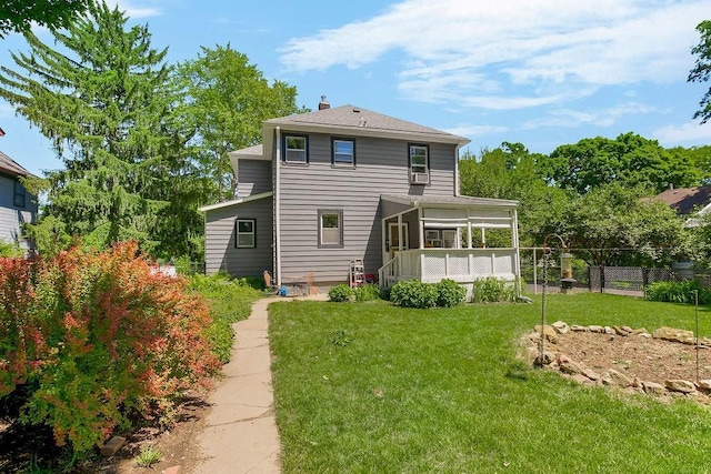 2312 Maple Ave, Leavenworth, KS 66048 - back of property featuring a sunroom and a chimney