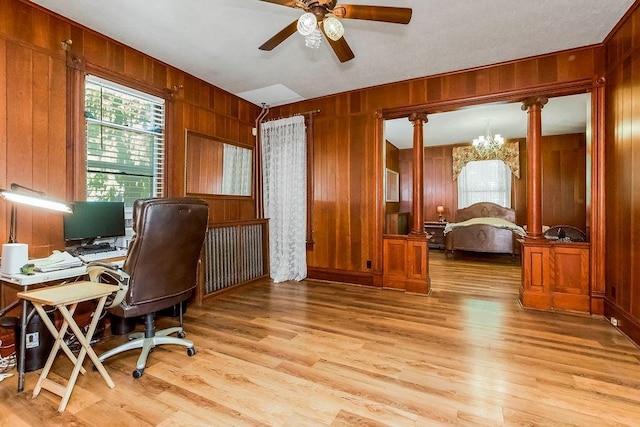 2312 Maple Ave, Leavenworth, KS 66048 - home office with wooden walls, light wood-style floors, ceiling fan, and a chandelier