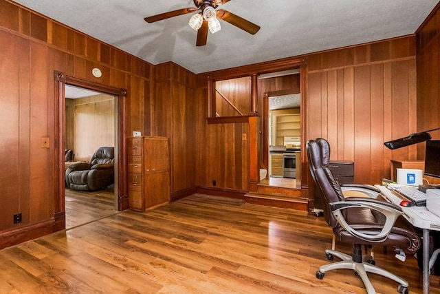 2312 Maple Ave, Leavenworth, KS 66048 - office area with wood walls, a ceiling fan, and wood finished floors